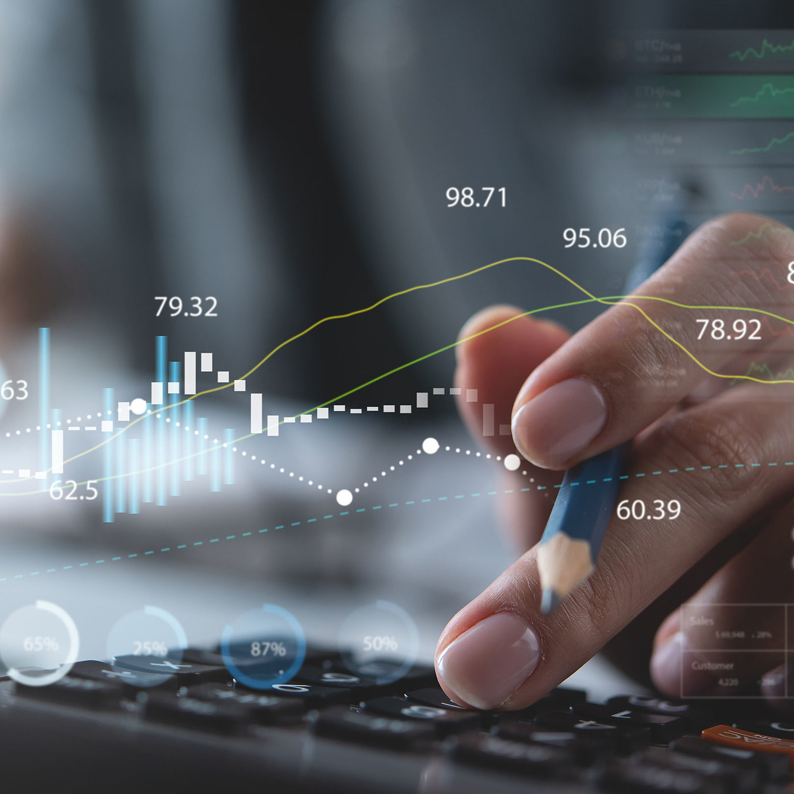 Illustrative image of data and graphs overlapping a persons hands using a calculator